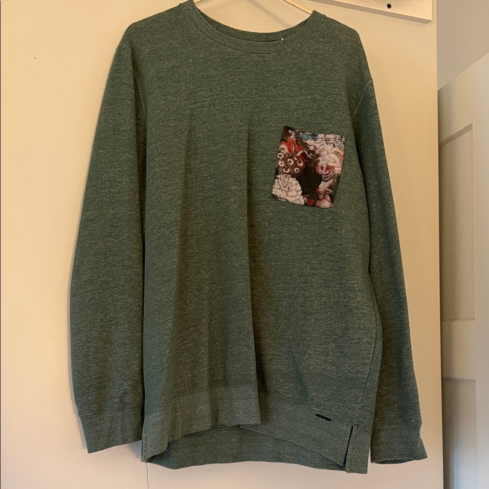 on the byas Men's Heather Green Crewneck with Floral Chest Pocket